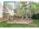 Cozy outdoor fire pit area with seating, perfect for entertaining and enjoying evenings at 111 Painted Bunting Dr, Troutman, NC 28166