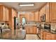 Well-equipped kitchen featuring wooden cabinets and countertops with modern stainless steel appliances at 111 Painted Bunting Dr, Troutman, NC 28166