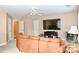 Inviting living room features a large comfy couch, tv, and neutral decor at 111 Painted Bunting Dr, Troutman, NC 28166