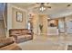 Cozy living room with neutral walls, brick accents, comfortable seating, and access to kitchen at 111 Painted Bunting Dr, Troutman, NC 28166