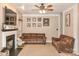 Comfortable living room featuring a fireplace, plush seating, and decorative elements for a cozy ambiance at 111 Painted Bunting Dr, Troutman, NC 28166