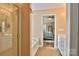 This bathroom features a shower and a tub with a view through to the main bedroom at 111 Painted Bunting Dr, Troutman, NC 28166