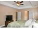 Bright main bedroom with tray ceilings and plenty of natural light coming through the windows at 111 Painted Bunting Dr, Troutman, NC 28166