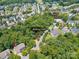 Aerial view of the neighborhood with tree coverage, walking trails, and a community pool at 1125 Victoria Blake Ln, Belmont, NC 28012
