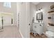 Stylish powder room with white vanity, elegant mirror, and modern lighting fixtures at 1125 Victoria Blake Ln, Belmont, NC 28012