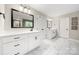 Spacious bathroom featuring dual vanities, framed mirrors, and walk-in shower with marble floors at 1125 Victoria Blake Ln, Belmont, NC 28012