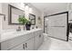 Bright bathroom with double vanity, framed mirrors, and walk-in shower with black accents at 1125 Victoria Blake Ln, Belmont, NC 28012
