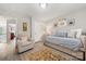 Neutral bedroom with natural lighting, chair, daybed, and decorative rug at 1125 Victoria Blake Ln, Belmont, NC 28012