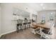 Eat in breakfast nook with open access to modern kitchen and black metal bar stools at 1125 Victoria Blake Ln, Belmont, NC 28012