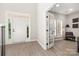 Welcoming foyer features a paneled front door, sidelights, transom window, and an office with glass doors at 1125 Victoria Blake Ln, Belmont, NC 28012