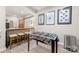 Finished basement featuring a foosball table, bar seating, and modern decor at 1125 Victoria Blake Ln, Belmont, NC 28012