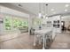 Open concept kitchen with large island, stainless steel appliances, and adjacent dining area at 1125 Victoria Blake Ln, Belmont, NC 28012
