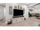 Cozy living area featuring a large flat screen TV and doorway leading to a separate living space at 1125 Victoria Blake Ln, Belmont, NC 28012