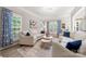 Bright living room with neutral palette, a sofa set, multiple windows and unique drapes at 1125 Victoria Blake Ln, Belmont, NC 28012