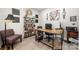 Cozy office with a modern wood desk, wood shelf, and a comfortable chair at 1125 Victoria Blake Ln, Belmont, NC 28012