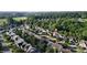 An aerial view shows a beautiful neighborhood surrounded by lush greenery at 119 Tilton Dr, Mooresville, NC 28115