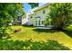 This backyard features a brick fire pit, lush grass, and shade trees at 119 Tilton Dr, Mooresville, NC 28115