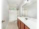 This full bath features a shower-tub combo and a wooden vanity cabinet at 119 Tilton Dr, Mooresville, NC 28115