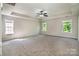 Spacious bedroom with neutral carpet and multiple windows for plenty of light at 119 Tilton Dr, Mooresville, NC 28115