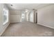 Large bonus room with a ceiling fan, carpeted floors, and bright, natural light at 119 Tilton Dr, Mooresville, NC 28115