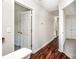 Upstairs hallway with wood floors and several white doors at 119 Tilton Dr, Mooresville, NC 28115
