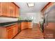 Modern kitchen with stainless steel appliances, granite countertops, and ample cabinet space, with view to living area at 119 Tilton Dr, Mooresville, NC 28115