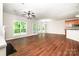 Open living area with wood flooring and view of backyard, perfect for entertaining and relaxation at 119 Tilton Dr, Mooresville, NC 28115