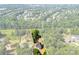 An aerial view highlighting the property lines of a gray two-story home encircled by an abundance of trees at 1227 Breezewood Dr, Charlotte, NC 28262