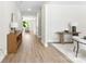 Bright entryway featuring hardwood floors, neutral walls, and ample space for furniture at 1227 Breezewood Dr, Charlotte, NC 28262