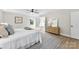Light filled main bedroom featuring ensuite bathroom, dresser and soft decor for a peaceful retreat at 1227 Breezewood Dr, Charlotte, NC 28262