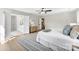 Spacious main bedroom with doors to ensuite, neutral decor and plush rug enhancing comfort and style at 1227 Breezewood Dr, Charlotte, NC 28262