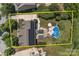 Aerial shot of property with solar panels, pool, patio, and fenced backyard at 125 Snow Fountain Ln, Mooresville, NC 28115