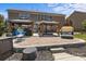A spacious brick patio features outdoor seating areas under wooden pergolas, perfect for entertaining and relaxing at 125 Snow Fountain Ln, Mooresville, NC 28115