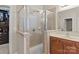 Spacious bathroom features glass shower, tiled floors and wood vanity with sink at 125 Snow Fountain Ln, Mooresville, NC 28115