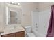 Well lit bathroom has a bathtub with shower and a wood vanity with sink at 125 Snow Fountain Ln, Mooresville, NC 28115
