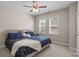 Comfortable bedroom featuring a ceiling fan, two windows, and a cozy bed at 125 Snow Fountain Ln, Mooresville, NC 28115
