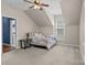 Cozy bedroom with sloped ceilings features natural light and neutral paint at 125 Snow Fountain Ln, Mooresville, NC 28115