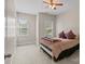 Light-filled bedroom featuring neutral walls, carpeted floors, and two bright windows at 125 Snow Fountain Ln, Mooresville, NC 28115