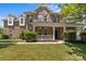 Attractive brick home with a well-maintained lawn and inviting covered front porch at 125 Snow Fountain Ln, Mooresville, NC 28115