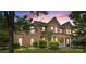 Charming two-story brick home with a welcoming front porch and manicured landscaping at 125 Snow Fountain Ln, Mooresville, NC 28115