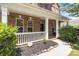 Charming front porch with white railing, brick facade, and well-kept landscaping at 125 Snow Fountain Ln, Mooresville, NC 28115