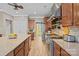 Well-equipped kitchen featuring modern appliances, ample counter space, and wood flooring at 125 Snow Fountain Ln, Mooresville, NC 28115