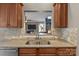 Granite countertops and stainless steel appliances are viewed from this angle of the kitchen at 125 Snow Fountain Ln, Mooresville, NC 28115