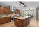Spacious kitchen with a large island, stainless steel appliances, and a view to the dining area at 125 Snow Fountain Ln, Mooresville, NC 28115