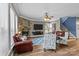 Bright living room showcasing a fireplace, hardwood floors, and staircase at 125 Snow Fountain Ln, Mooresville, NC 28115