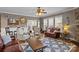 Spacious living room featuring hardwood floors, ample seating and natural light at 125 Snow Fountain Ln, Mooresville, NC 28115