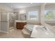 Luxurious main bathroom features a separate shower, soaking tub and dual sinks at 125 Snow Fountain Ln, Mooresville, NC 28115