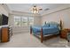 Spacious main bedroom features plush carpet, lots of natural light and a ceiling fan at 125 Snow Fountain Ln, Mooresville, NC 28115