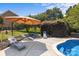 Inviting backyard pool area features a lounge area with stylish seating, a large patio, and lush landscaping at 125 Snow Fountain Ln, Mooresville, NC 28115