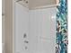Shower stall with a bright shower curtain, grab bar, and built-in shelving at 125 Snow Fountain Ln, Mooresville, NC 28115